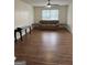 Spacious living room with hardwood floors, neutral tones, and natural light at 2791 Biscayne Dr, Conyers, GA 30012