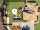 Outdoor entertaining space with a fire pit and dining area for this brick home at 200 Magnolia Ct, Mcdonough, GA 30252