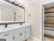 Modern bathroom features double sink vanity with decorative mirror at 200 Magnolia Ct, Mcdonough, GA 30252