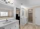 Bright bathroom showcasing dual sinks, marble countertops and contemporary mirrors at 200 Magnolia Ct, Mcdonough, GA 30252