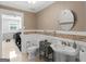 Bathroom with classic sink and a laundry room at 200 Magnolia Ct, Mcdonough, GA 30252