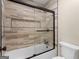 Contemporary bathroom highlighting a tiled shower with a glass door at 200 Magnolia Ct, Mcdonough, GA 30252