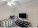 Neutral bedroom with carpeting, television, and ceiling fan at 200 Magnolia Ct, Mcdonough, GA 30252