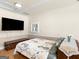 Relaxing bedroom featuring natural light, tv, and calming decor for restful nights at 200 Magnolia Ct, Mcdonough, GA 30252