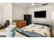 Comfortable bedroom with kitchenette, tv, and serene ambiance for relaxation and rest at 200 Magnolia Ct, Mcdonough, GA 30252
