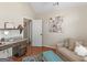 Bedroom with hardwood floors, neutral paint, pull out couch, and functional desk at 200 Magnolia Ct, Mcdonough, GA 30252