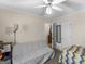 Cozy bedroom featuring a ceiling fan, closet, and a comfortable seating area at 200 Magnolia Ct, Mcdonough, GA 30252