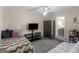 Neutral bedroom with carpeting, television, armoire and ceiling fan at 200 Magnolia Ct, Mcdonough, GA 30252