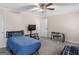 Inviting bedroom featuring a ceiling fan, TV, and neutral walls at 200 Magnolia Ct, Mcdonough, GA 30252