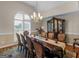 Elegant dining room showcasing a large table and ornate china cabinet at 200 Magnolia Ct, Mcdonough, GA 30252