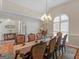 Elegant dining room showcasing a large table and ornate chandelier at 200 Magnolia Ct, Mcdonough, GA 30252