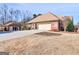 Charming brick home with sparse lawn, attached garage, and separate entry building at 200 Magnolia Ct, Mcdonough, GA 30252