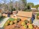 Brick home and gated entrance with lush landscaping, offering both privacy and charm at 200 Magnolia Ct, Mcdonough, GA 30252