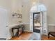 Inviting foyer with hardwood floors and natural light streaming through the front door at 200 Magnolia Ct, Mcdonough, GA 30252