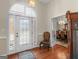 Charming foyer featuring hardwood floors and a decorative glass front door at 200 Magnolia Ct, Mcdonough, GA 30252