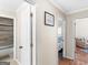 Hallway featuring hardwood floors, views into the bathroom and bedroom at 200 Magnolia Ct, Mcdonough, GA 30252