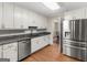 Modern kitchen featuring granite countertops and stainless steel appliances at 200 Magnolia Ct, Mcdonough, GA 30252