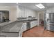 Modern kitchen featuring granite countertops and stainless steel appliances at 200 Magnolia Ct, Mcdonough, GA 30252