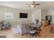 Inviting living room and dining area with ample natural light, hardwood floors, and stylish furnishings at 200 Magnolia Ct, Mcdonough, GA 30252