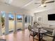 Bright living room area featuring expansive sliding glass doors offering picturesque backyard views at 200 Magnolia Ct, Mcdonough, GA 30252