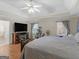 Serene main bedroom featuring hardwood floors, ample natural light, and modern decor at 200 Magnolia Ct, Mcdonough, GA 30252