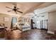 Spacious bedroom featuring two ceiling fans, a king bed, and exercise equipment at 100 Williams Blf, Mcdonough, GA 30252
