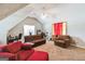 Versatile bonus room with vaulted ceilings, comfortable seating, and natural light at 100 Williams Blf, Mcdonough, GA 30252