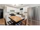 Bright kitchen with white cabinets, stainless steel appliances, and central island at 100 Williams Blf, Mcdonough, GA 30252
