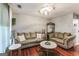 Cozy living room featuring hardwood floors, neutral tones, and comfortable seating at 100 Williams Blf, Mcdonough, GA 30252