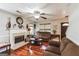 Inviting living room with fireplace, hardwood floors, and a view of the front door at 100 Williams Blf, Mcdonough, GA 30252