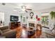 Comfortable living room with a fireplace, hardwood floors, and natural light at 100 Williams Blf, Mcdonough, GA 30252
