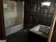 Damaged bathroom with exposed walls, a sink, and a shower at 65 Little John Trl, Hampton, GA 30228