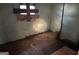 View of a bedroom with a boarded-up window in need of repair at 65 Little John Trl, Hampton, GA 30228