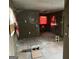 Damaged living room with exposed walls at 65 Little John Trl, Hampton, GA 30228