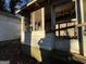 View of broken glass on an enclosed front porch at 65 Little John Trl, Hampton, GA 30228