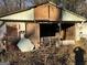 Damaged shed exterior at 65 Little John Trl, Hampton, GA 30228