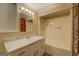 Bathroom featuring a shower, vanity, marble countertop and matching cabinets at 34 Ivy St, Porterdale, GA 30014