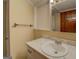 A bathroom featuring a sink with a marble countertop and matching cabinets at 34 Ivy St, Porterdale, GA 30014