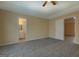 Spacious bedroom with wall to wall carpet and adjacent full bathroom and walk-in closet at 34 Ivy St, Porterdale, GA 30014