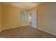 Bedroom featuring carpeted floors and a window at 34 Ivy St, Porterdale, GA 30014