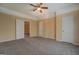 Bright bedroom with neutral walls, carpeted flooring, and convenient access to other rooms in the home at 34 Ivy St, Porterdale, GA 30014