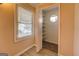 A walk-in closet featuring vinyl floors, a window, and shelves at 34 Ivy St, Porterdale, GA 30014