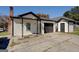 Charming home featuring a garage and outbuilding at 34 Ivy St, Porterdale, GA 30014