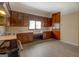 Spacious kitchen with stainless steel appliances and tile countertops and vintage wood cabinetry at 34 Ivy St, Porterdale, GA 30014