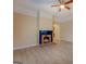 Open living room showcasing light wood-look flooring, and a classic fireplace with stone surround at 34 Ivy St, Porterdale, GA 30014