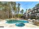 Private backyard with pool, spa, patio and mature trees at 3320 Lost Valley Dr, Jonesboro, GA 30236