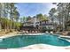 Inviting backyard features a large pool surrounded by mature trees at 3320 Lost Valley Dr, Jonesboro, GA 30236
