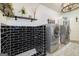 Laundry room featuring black tiled walls, utility sink, modern appliances, and ample space at 3320 Lost Valley Dr, Jonesboro, GA 30236