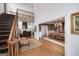 Spacious living area with a staircase, balcony, fireplace and dining area perfect for both relaxing and entertaining at 3320 Lost Valley Dr, Jonesboro, GA 30236