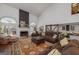 Inviting living room showcasing a fireplace, vaulted ceilings, and stylish barn doors, creating a warm atmosphere at 3320 Lost Valley Dr, Jonesboro, GA 30236